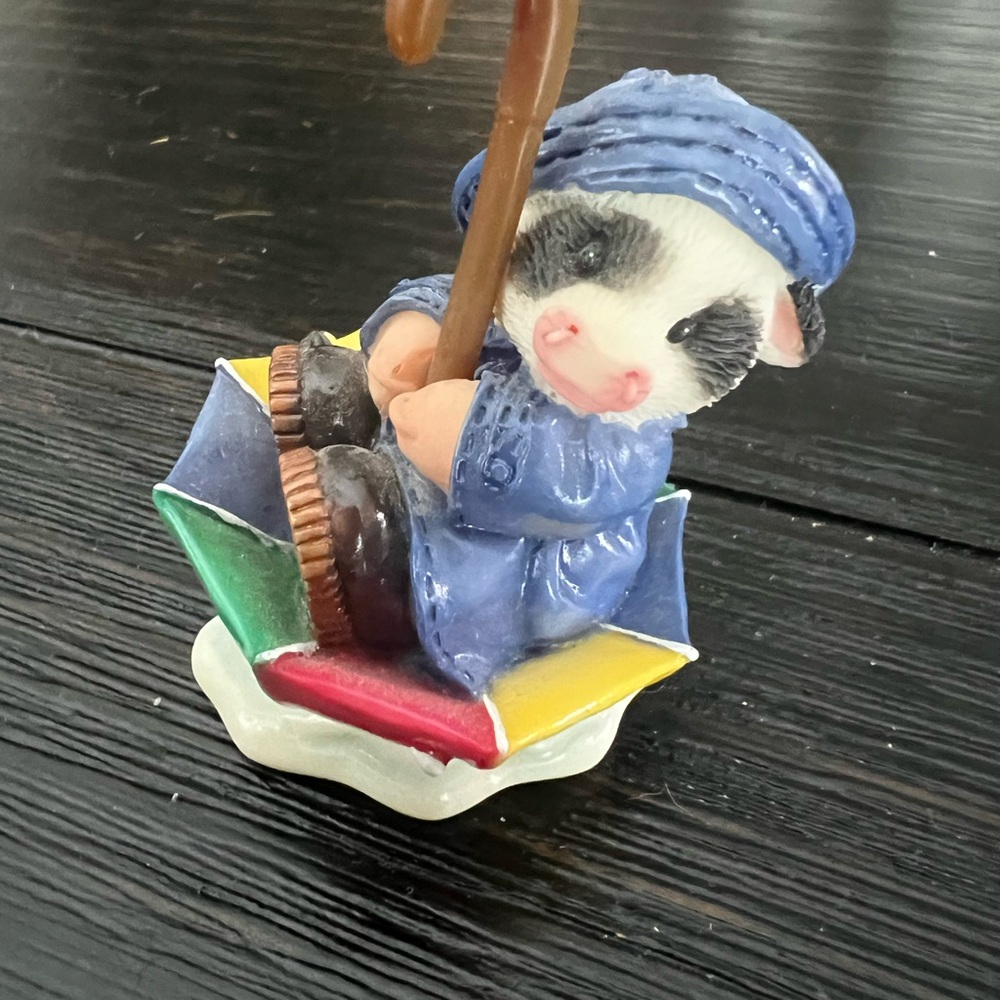 Mary’s Moo Moos “You Keep Moo Afloat” Cow Figurine in Blue Raincoat